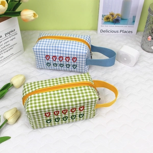 Checkered makeup bags with heart embroidery and top handles for portable storage