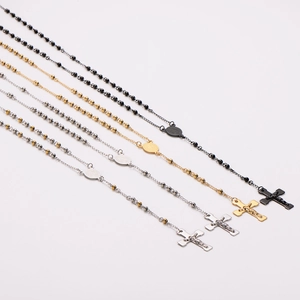 Religious stainless steel rosary necklaces in black, gold, and silver with cross pendants