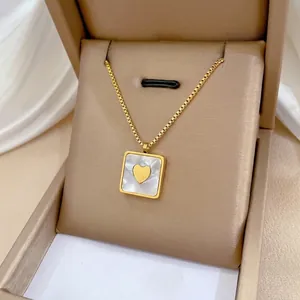 Gold titanium steel square pendant necklace with heart detail on mother-of-pearl base