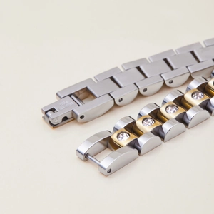 Polished stainless steel bracelets in silver and gold-tone with diamond inlay details