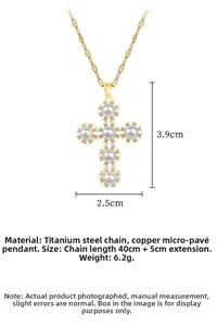 Detailed close-up of a titanium steel cross pendant necklace with pearls and tiny crystals