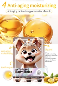 Detail of Moika anti-aging facial mask with golden essence sphere and dog illustration