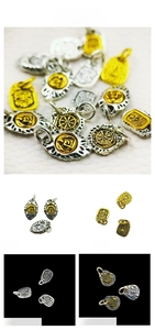Detailed view of vintage Tibetan alloy pendants featuring ethnic patterns and lucky motifs