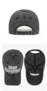Detailed close-up of retro washed cotton baseball cap with 3D New Rocker embroidery