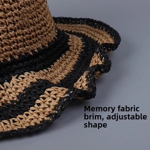 Detailed macro shot of striped straw hat showing internal memory wire for flexible brim styling