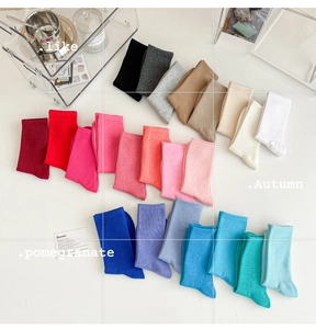 Flat lay of colorful ribbed cotton crew socks in vibrant candy colors and soft textures