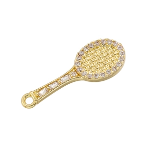 Detailed view of a gold badminton racket pendant with sparkling crystal embellishments