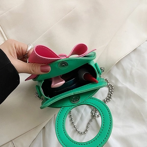 Mini green PU leather handbag with pink bow and metal chain handle for women