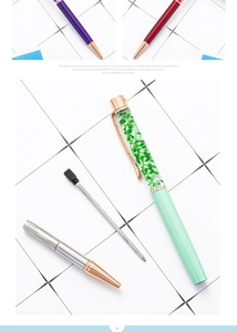 Exploded view showing components of DIY herbarium ballpoint pen with green dried flowers