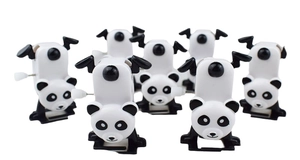Detailed macro view of wind-up panda toys showing the mechanical knobs and plastic finish