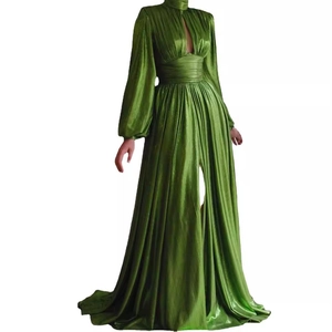 Detail of avocado green metallic evening gown with pleated texture and high side slit