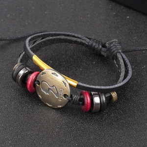 Detail of multi-layer leather bracelet with Gemini bronze charm and colorful beads