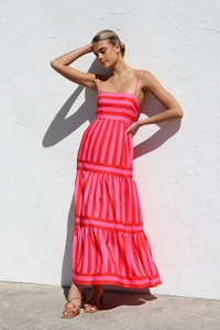 Detail view of pink and red striped tiered dress with high waist and backless straps