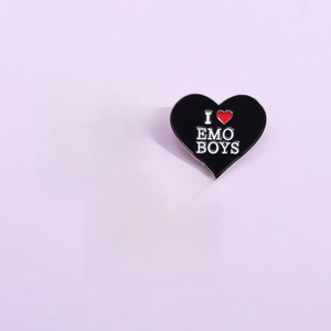 Three-piece black heart enamel pins set with bold slogans on a purple background