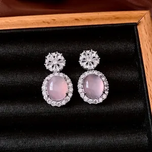 Vintage silver earrings with oval pink chalcedony and zircon set in a black velvet box