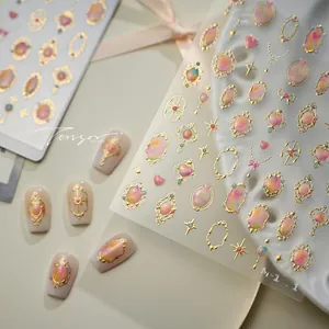 Detailed close-up of French vintage baroque nail art stickers with gold frame and colorful gems