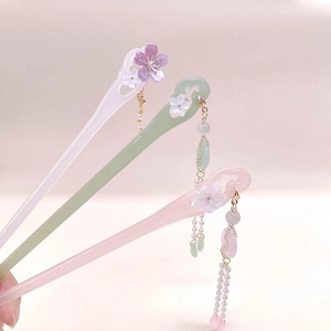 Traditional flower hair pin with tassels and pearls in pink, green, and white colors