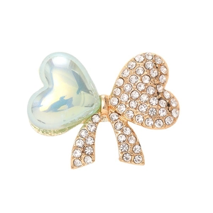 Accessoire nœud sirène doré avec strass brillants et pierre précieuse en forme de cœur
