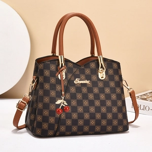 Brown checkered handbag for women with top handles and a decorative cherry charm