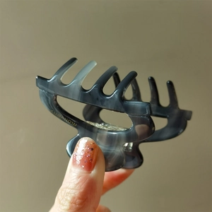Deep grey iridescent hollow hair claw clip with acetate texture for half-up hairstyles