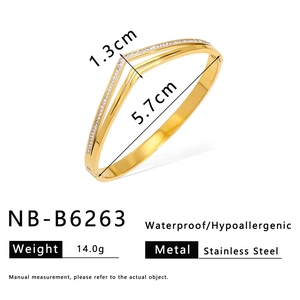 Detailed view of gold stainless steel bangle with V-shaped design and zircon inlay measurements