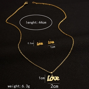 Detailed size chart of gold Love script necklace and earrings set on black leather