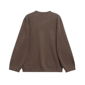 Detail view of the ribbed cuffs and hem on this dark brown V-neck knit cardigan