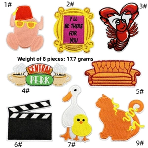 Detailed embroidery of Friends TV show patches including lobster and orange sofa icon