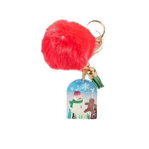 Christmas snowman keychain with a red plush pom pom, acrylic charms and green tassel