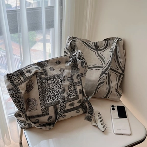 Detail of bohemian and geometric cotton linen tote bags with adjustable wide shoulder straps