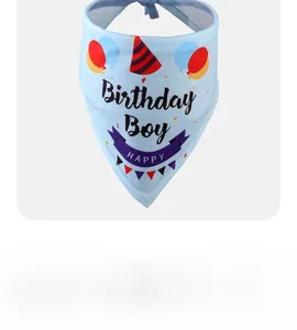 Detail of light blue pet birthday bandana with Birthday Boy print and festive patterns