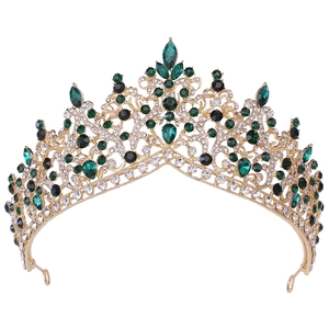 Luxurious gold bridal crown with emerald green crystals and rhinestones for weddings