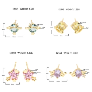 Detailed views of 18k gold plated star and moon stud earrings with AAA cubic zirconia