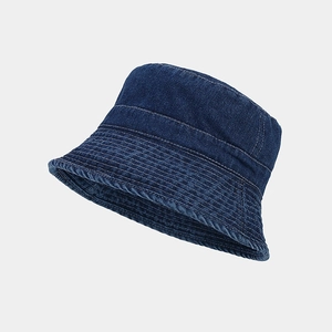 Detailed close-up of dark blue denim bucket hat with reinforced stitching on brim