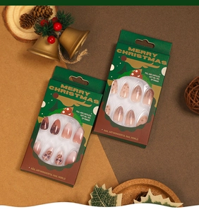 Christmas soft gel nail tips with pink gradient, snowflake patterns, and bow decorations