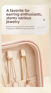 Detail of pink velvet jewelry box with necklace hooks and a high-lid storage design