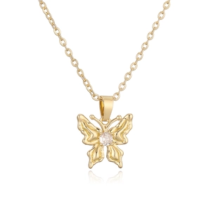 Elegant gold butterfly pendant necklace with white zircon stone on white background