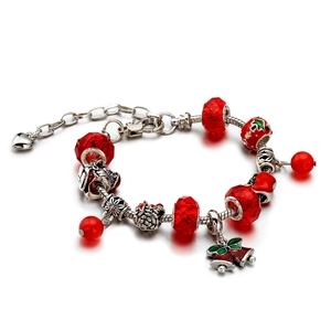 Christmas charm bracelet with red crystal beads, silver snake chain, and bell pendants