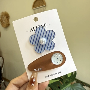 Floral and polka dot hair clip set with blue stripes and pearl on brand card