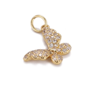 Close-up of golden butterfly charm with micro-pave white cubic zirconia stones