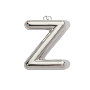 Macro detail of silver mirror polished 3D hollow letter Z pendant in stainless steel