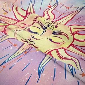 Close-up of bohemian tapestry showing soft velvet texture and celestial sun moon patterns