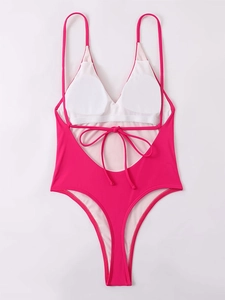 Detail view of backless one-piece swimsuit with adjustable straps and removable pads