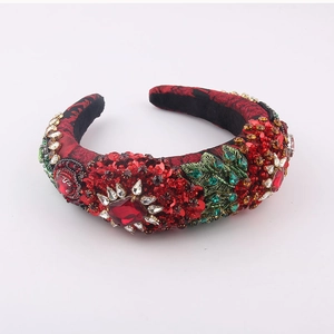 Macro shot of baroque style rhinestone headband with red fabric and leaf crystal embroidery