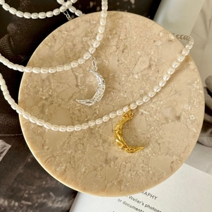925 Sterling Silver pearl necklace featuring a textured crescent moon pendant