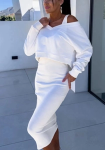 Women's chic white two-piece knit set featuring a cropped long sleeve top and midi skirt