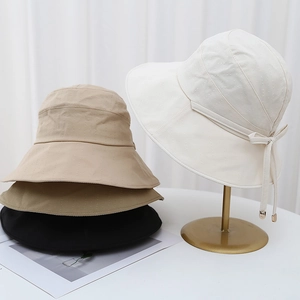 Elegant wide brim sun hat with ribbon bow for women in white, beige and black