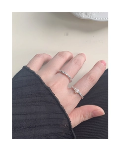 Detail of S925 silver rings with irregular silver nuggets and a pearl on hand