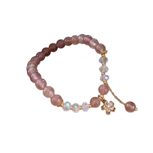 Elegant white crystal bead bracelet for women featuring pink quartz and a gold floral pendant
