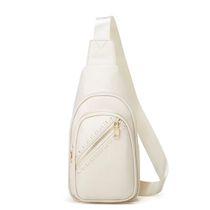 Close-up of cream litchi grain PU leather sling bag with gold metal zippers